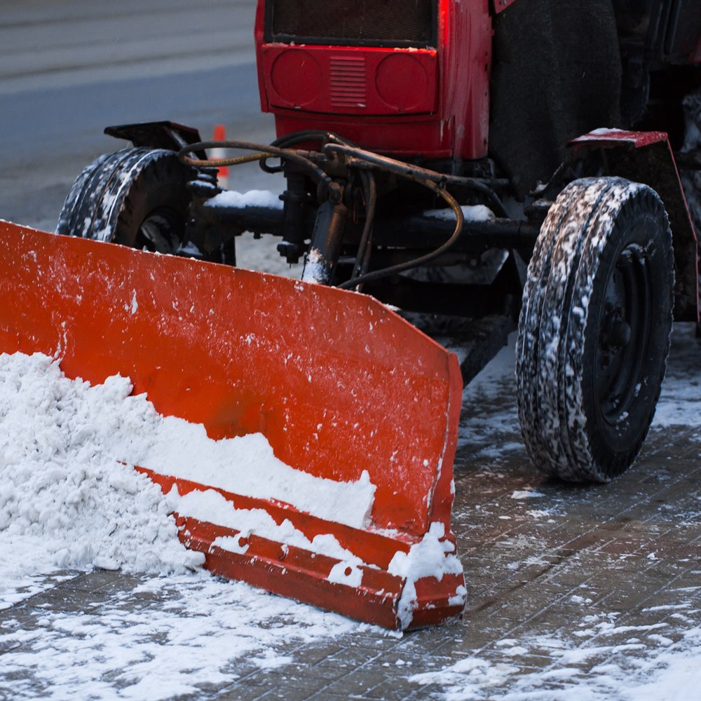 snow-plow-removing-snow-from-street-in-winter Snow plow removing snow from street in winter