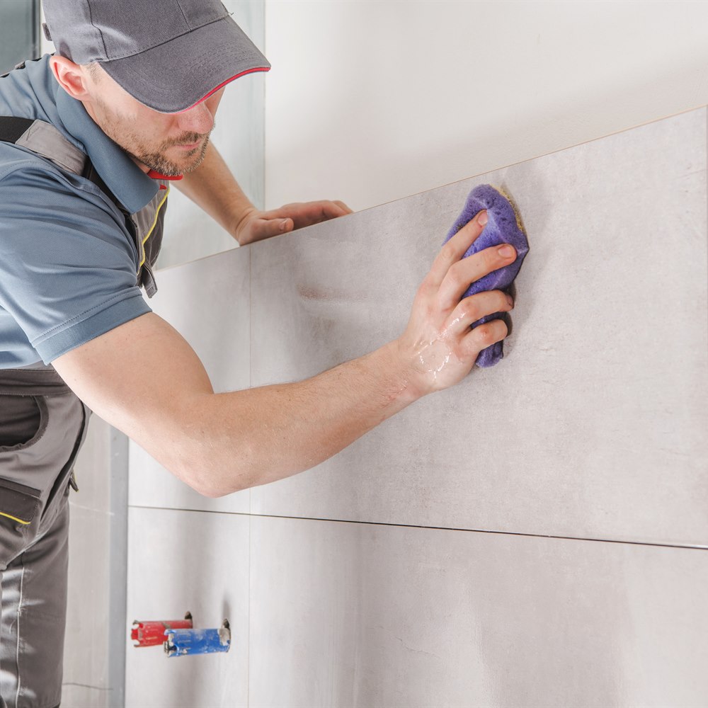 sponging-grout-from-wall-tile Sponging grout from wall tile