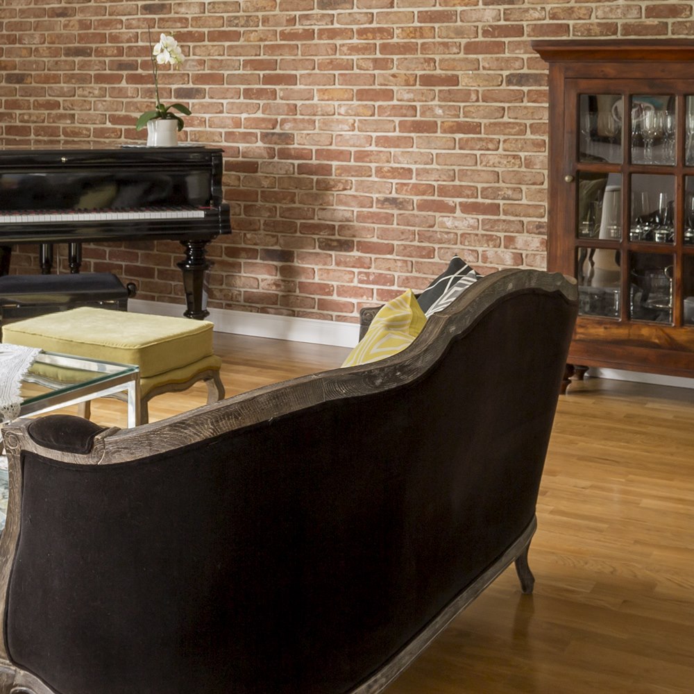 Stylish interior with piano and comfortable furniture