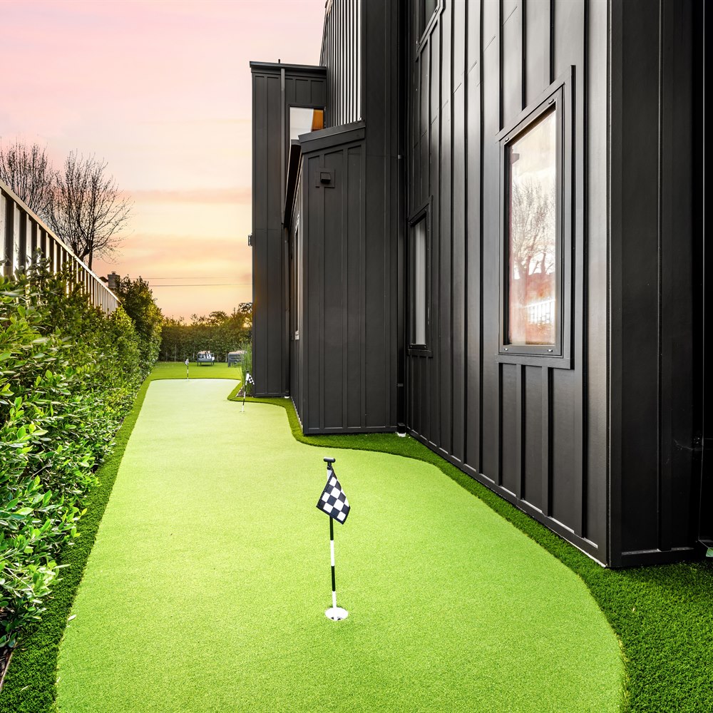 Suburban home backyard with miniature golf course