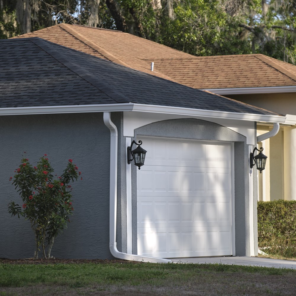 Suburban home with garage and well maintained lawn