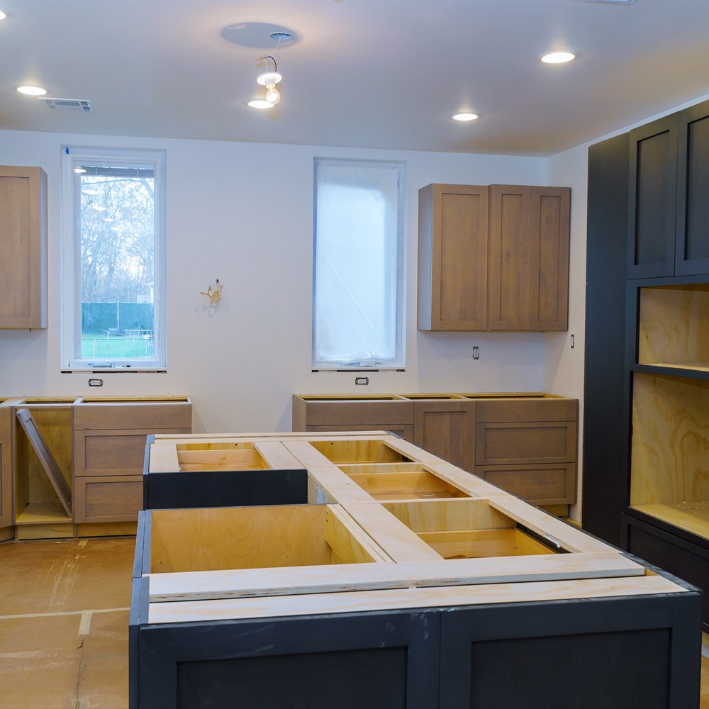 unfinished-kitchen-with-cabinets-being-installed Unfinished kitchen with cabinets being installed
