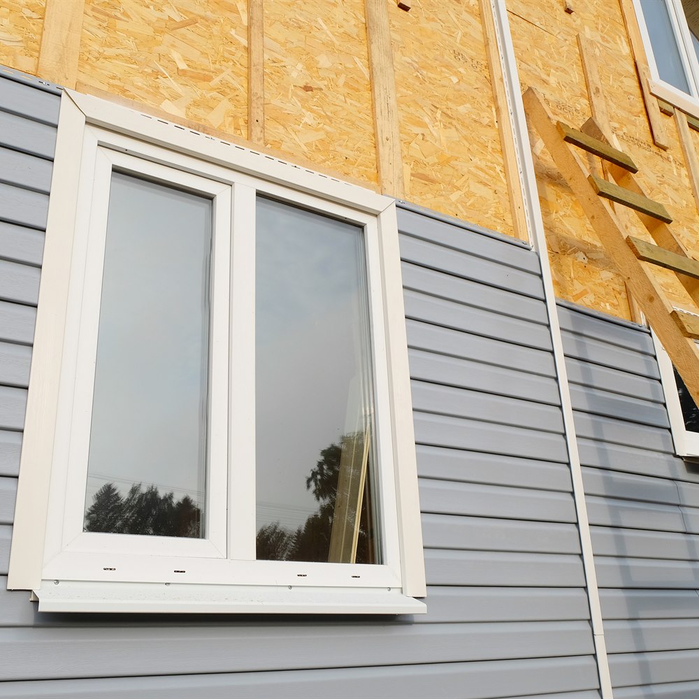 Vinyl siding installation over sheathing