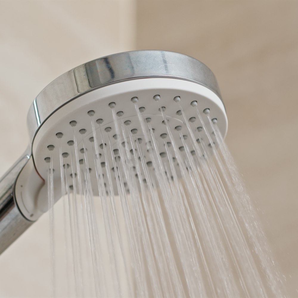water-flowing-from-a-modern-shower-head Water flowing from a modern shower head