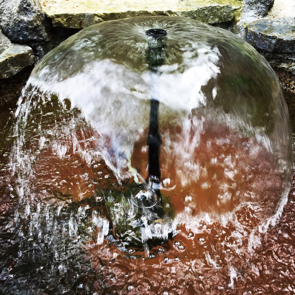 Water fountain dome with rock surroundings