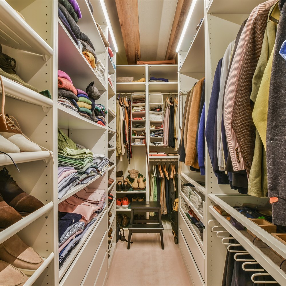 well-organized-walk-in-closet-with-clothing-shoes Well organized walk in closet with clothing shoes