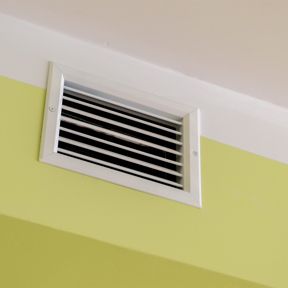 white-air-vent-on-a-yellow-wall White air vent on a yellow wall