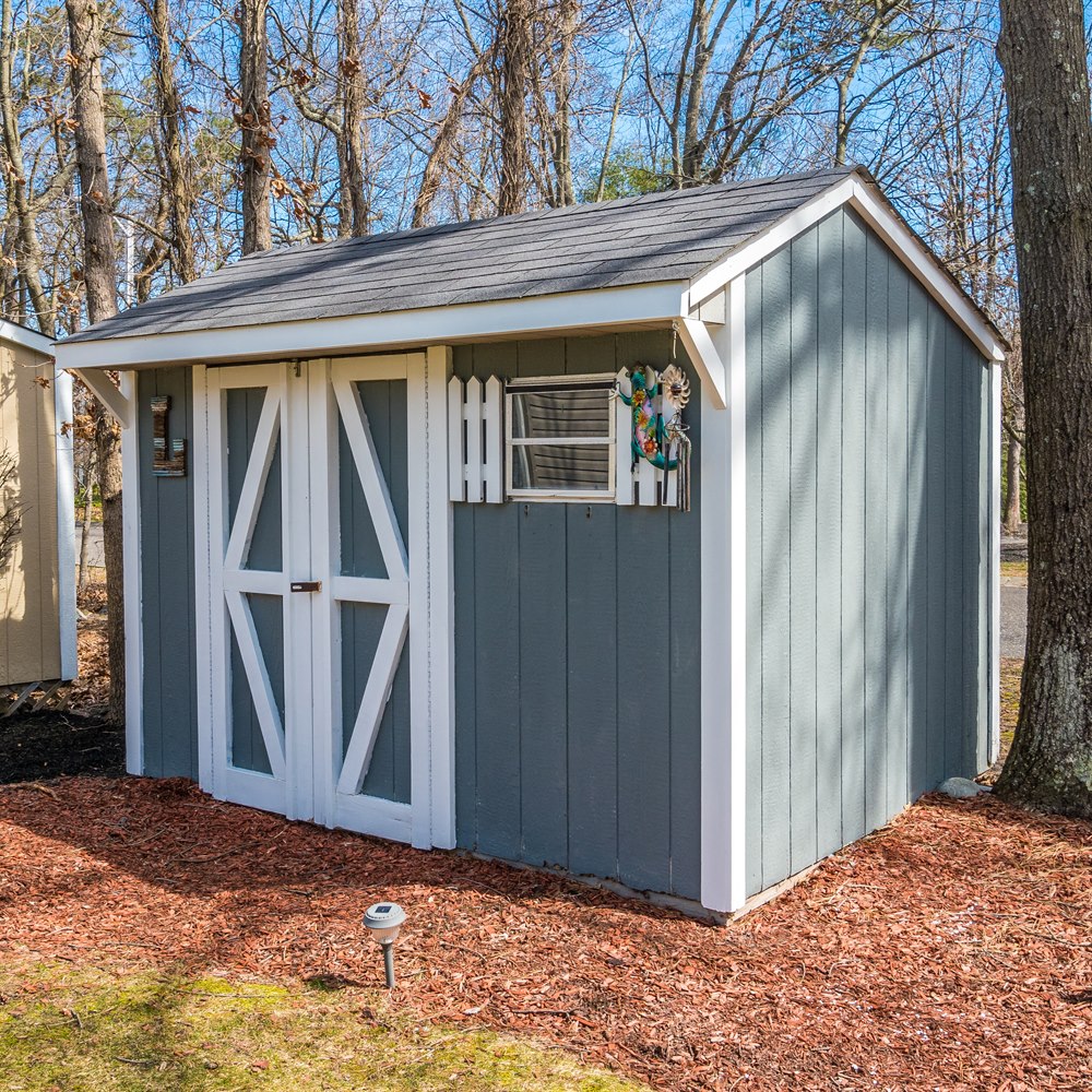 Wooden garden shed in a yard