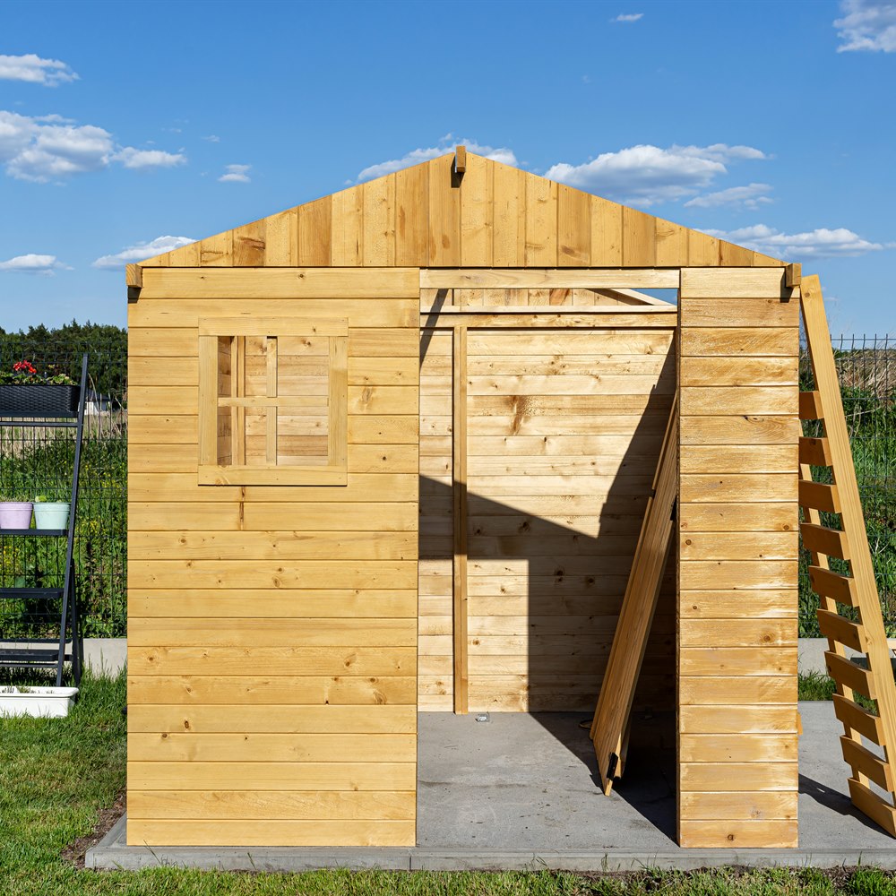 Wooden garden shed under construction on sunny day