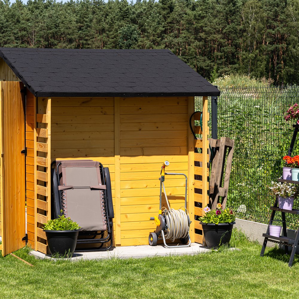 Wooden shed and flower ladder in a garden
